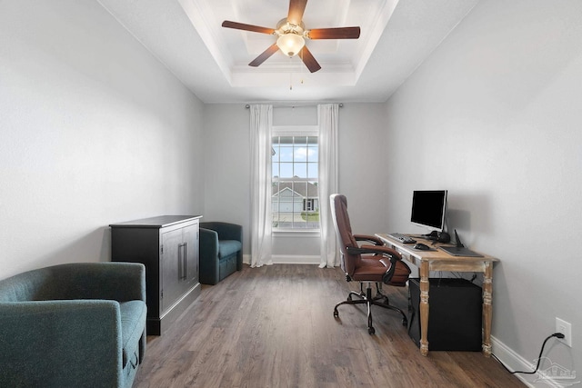 7908 Majestic Cypress Dr, Milton, FL 32583 - office featuring a raised ceiling, ceiling fan, baseboards, and wood finished floors