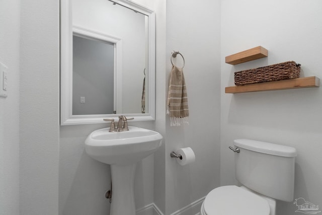 7908 Majestic Cypress Dr, Milton, FL 32583 - bathroom with a sink, baseboards, and toilet