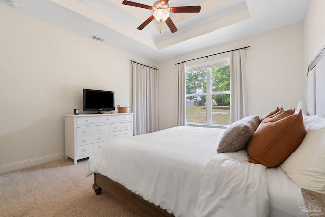 7908 Majestic Cypress Dr, Milton, FL 32583 - bedroom with ceiling fan, visible vents, a raised ceiling, baseboards, and light carpet