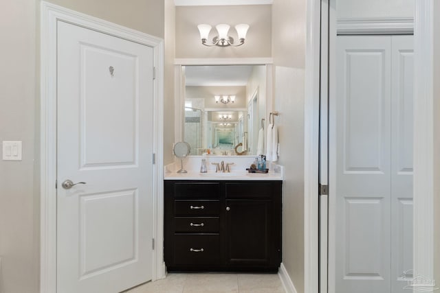 7908 Majestic Cypress Dr, Milton, FL 32583 - bathroom with vanity, tile patterned flooring, baseboards, and a closet