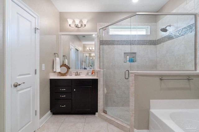 7908 Majestic Cypress Dr, Milton, FL 32583 - bathroom with vanity, tile patterned floors, baseboards, a bath, and a stall shower