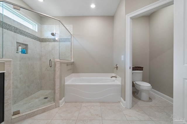 7908 Majestic Cypress Dr, Milton, FL 32583 - bathroom with toilet, baseboards, a garden tub, and a stall shower