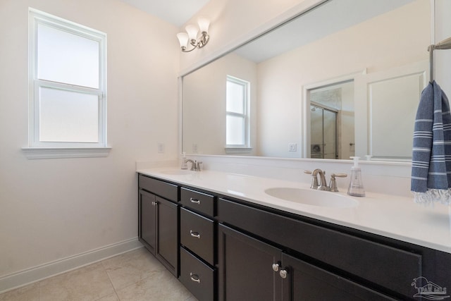 7908 Majestic Cypress Dr, Milton, FL 32583 - bathroom featuring double vanity, a shower stall, and a sink