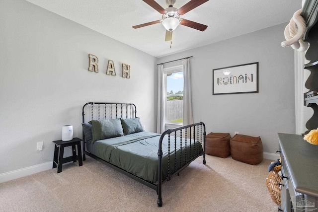 7908 Majestic Cypress Dr, Milton, FL 32583 - bedroom with baseboards, ceiling fan, and light carpet