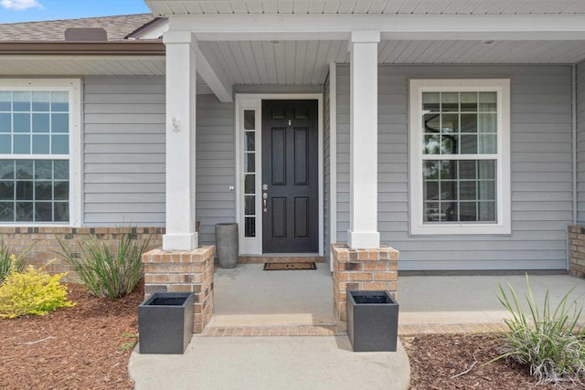 7908 Majestic Cypress Dr, Milton, FL 32583 - view of exterior entry featuring covered porch