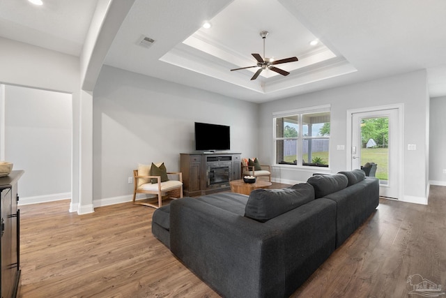 7908 Majestic Cypress Dr, Milton, FL 32583 - living area with visible vents, a ceiling fan, a raised ceiling, and wood finished floors
