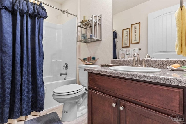 full bath with shower / tub combo, vanity, tile patterned flooring, and toilet