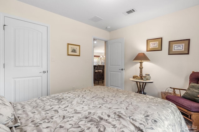 bedroom featuring visible vents