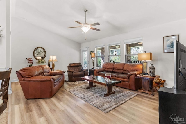 living room featuring light wood finished floors and ceiling fan