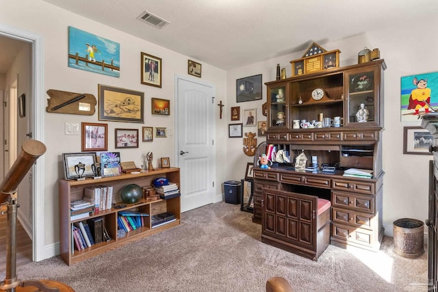carpeted home office with baseboards and visible vents