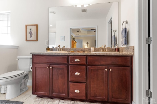 full bathroom featuring tile patterned floors, visible vents, a sink, and toilet