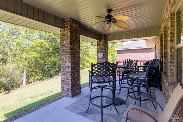 view of patio / terrace featuring outdoor dining area and a ceiling fan