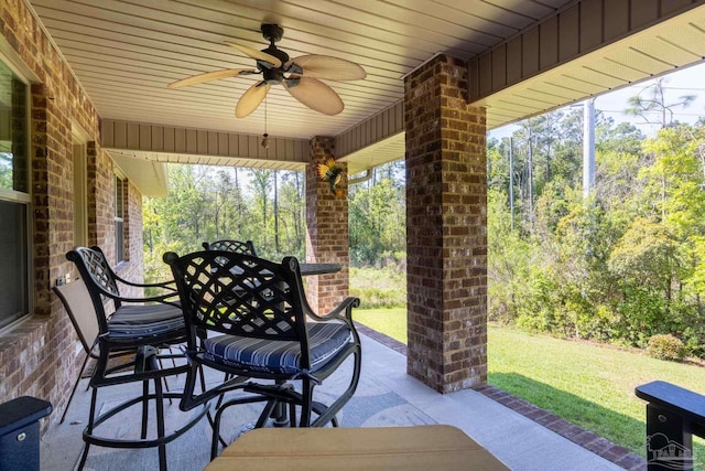 view of patio featuring ceiling fan and outdoor dining area