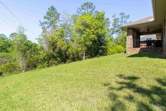 view of yard featuring a ceiling fan