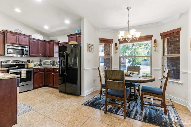 kitchen with stainless steel appliances, an inviting chandelier, light stone counters, and light tile patterned flooring