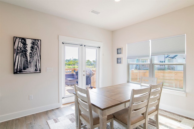 dining area with light hardwood / wood-style floors