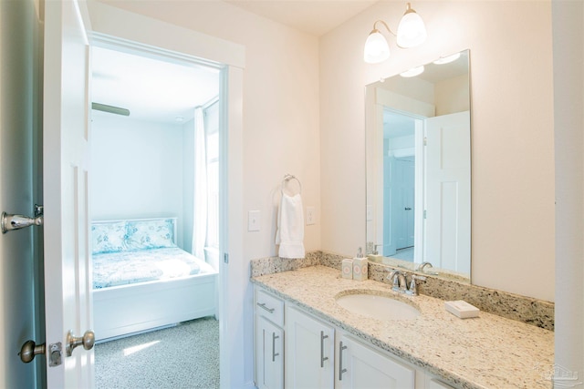 bathroom featuring a healthy amount of sunlight and vanity