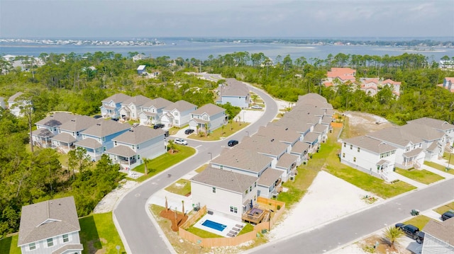 bird's eye view with a water view