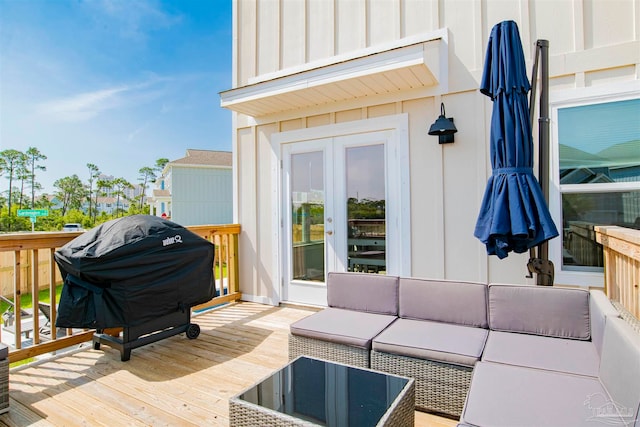 wooden deck featuring outdoor lounge area and area for grilling