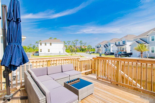 wooden deck featuring outdoor lounge area