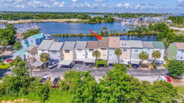 birds eye view of property with a water view