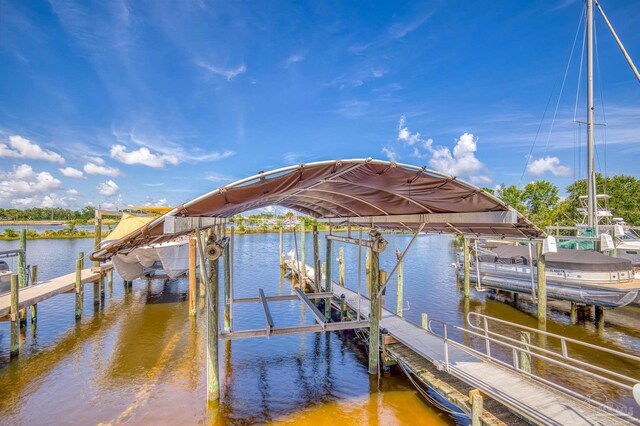 dock area featuring a water view