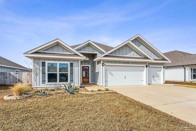 view of front facade with a garage and a front lawn