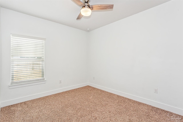 spare room featuring ceiling fan and carpet flooring