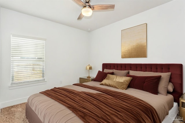 bedroom featuring ceiling fan and light colored carpet