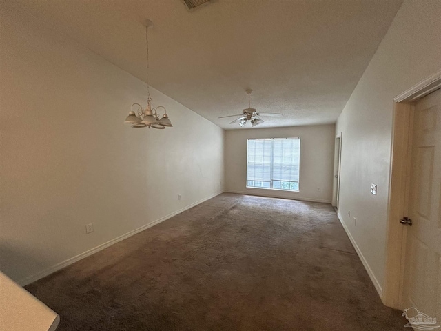 7101 Joy St Unit K7, Pensacola, FL 32504 - carpeted spare room featuring baseboards, a chandelier, a ceiling fan, and lofted ceiling