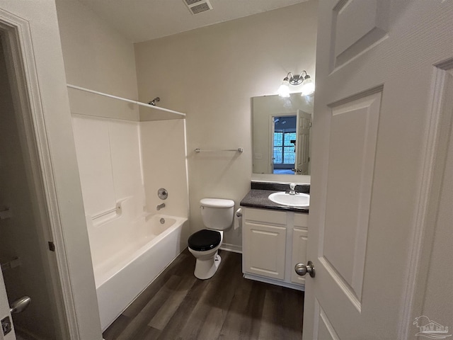 7101 Joy St Unit K7, Pensacola, FL 32504 - bathroom featuring toilet, vanity, shower / tub combination, and wood finished floors