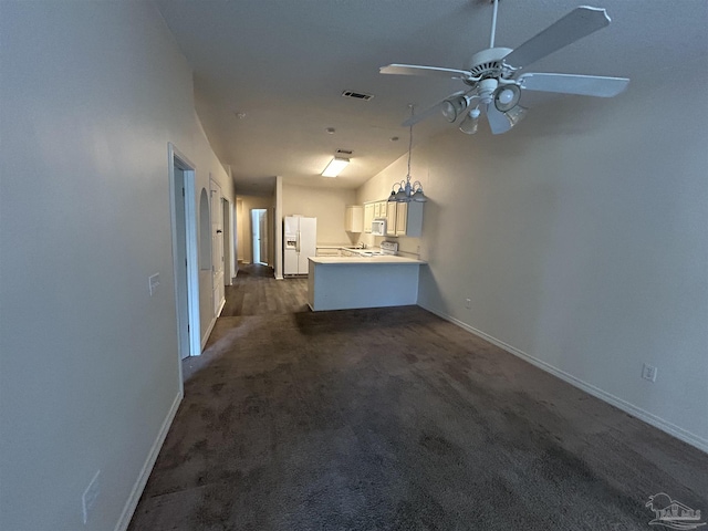 7101 Joy St Unit K7, Pensacola, FL 32504 - unfurnished living room featuring a ceiling fan, dark colored carpet, and baseboards
