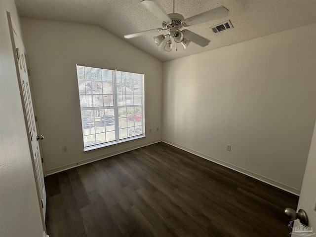7101 Joy St Unit K7, Pensacola, FL 32504 - empty room featuring dark wood finished floors, ceiling fan, a textured ceiling, vaulted ceiling, and baseboards