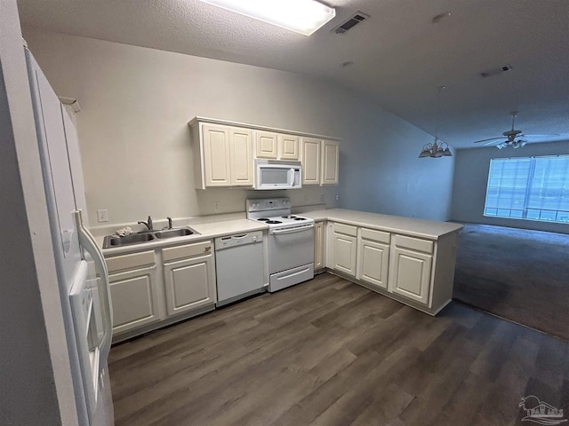 7101 Joy St Unit K7, Pensacola, FL 32504 - kitchen featuring white appliances, a sink, a peninsula, vaulted ceiling, and light countertops