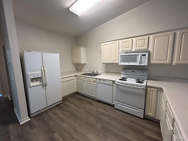 7101 Joy St Unit K7, Pensacola, FL 32504 - kitchen with white appliances, a sink, dark wood-type flooring, light countertops, and a textured ceiling