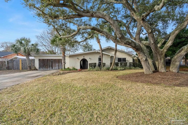 single story home with a front lawn and a carport