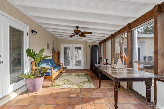 sunroom / solarium featuring vaulted ceiling with beams, ac unit, french doors, and ceiling fan