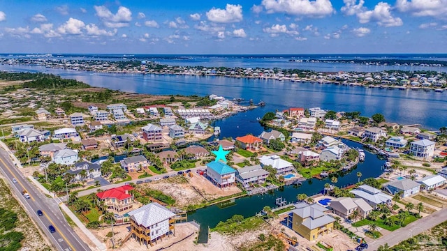 birds eye view of property featuring a residential view and a water view