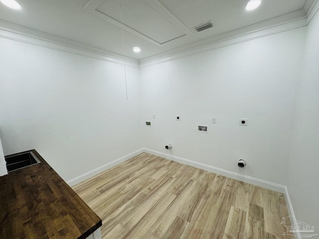 clothes washing area with visible vents, attic access, ornamental molding, hookup for a washing machine, and electric dryer hookup