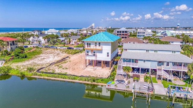 birds eye view of property featuring a residential view and a water view