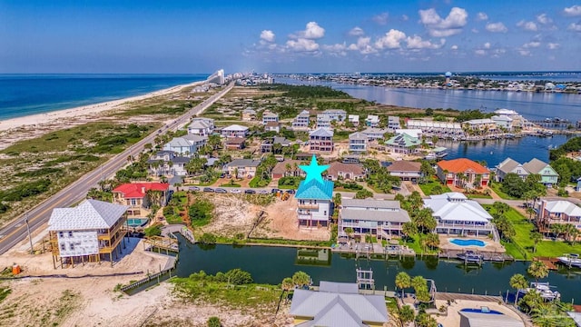 bird's eye view featuring a residential view and a water view