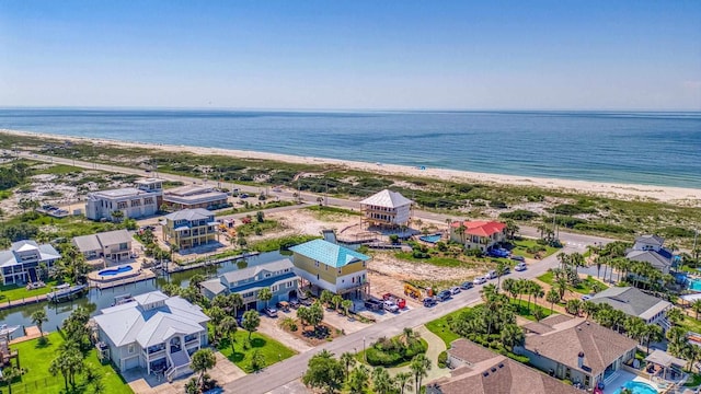 drone / aerial view with a view of the beach and a water view