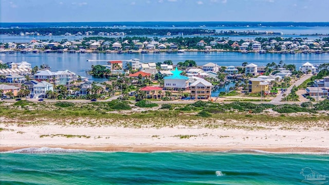 bird's eye view with a view of the beach and a water view