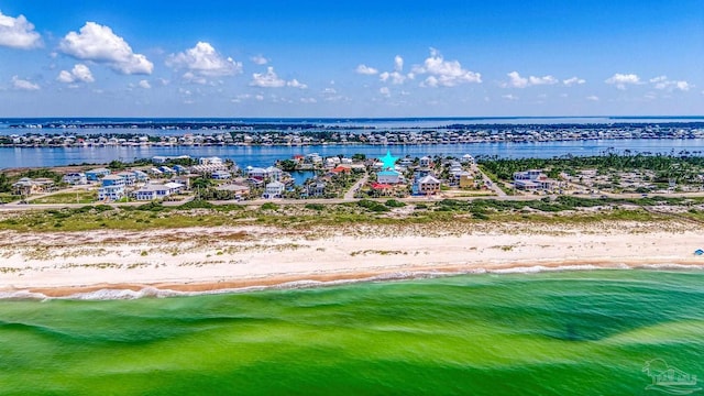 bird's eye view with a view of the beach and a water view