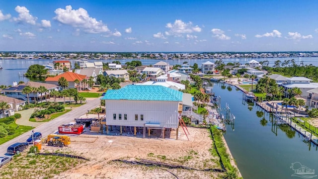 birds eye view of property featuring a residential view and a water view