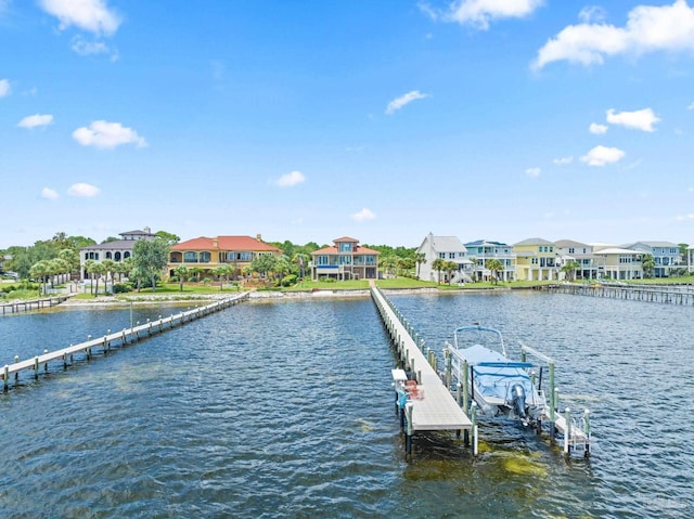 dock area featuring a residential view, a water view, and boat lift