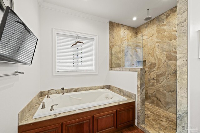 full bathroom featuring a garden tub, walk in shower, and crown molding