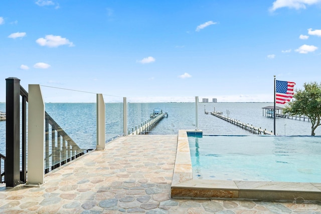 dock area with a water view