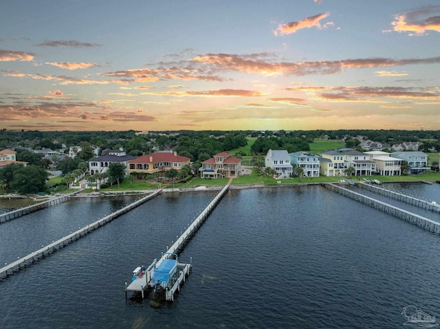 aerial view at dusk with a water view