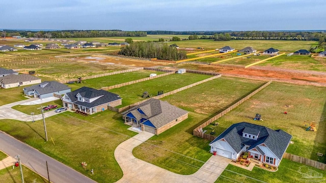 birds eye view of property with a rural view